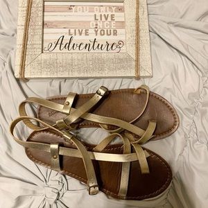 Gold criss cross sandals